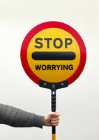 'Stop worrying' lollipop sign