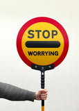 'Stop worrying' lollipop sign